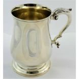 A Regency design silver one pint tankard, London 1958, by Richard Comyms, 13.5cm high, 14.