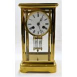 A four-glass brass cased mantle clock with mercury pendulum,