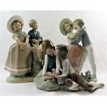 Three Lladro porcelain figural groups of courting couples, the tallest 25.