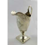 A Regency style silver cream jug, Chester 1912, with cast and engraved decoration, 15.8cm high, 4.