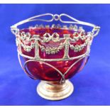 A Victorian silver sugar basket with cranberry glass liner, Birmingham 1899, 10.3cm diameter, 3.