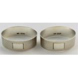 A pair of silver napkin rings with engine turned decoration, Birmingham 1959, 1.