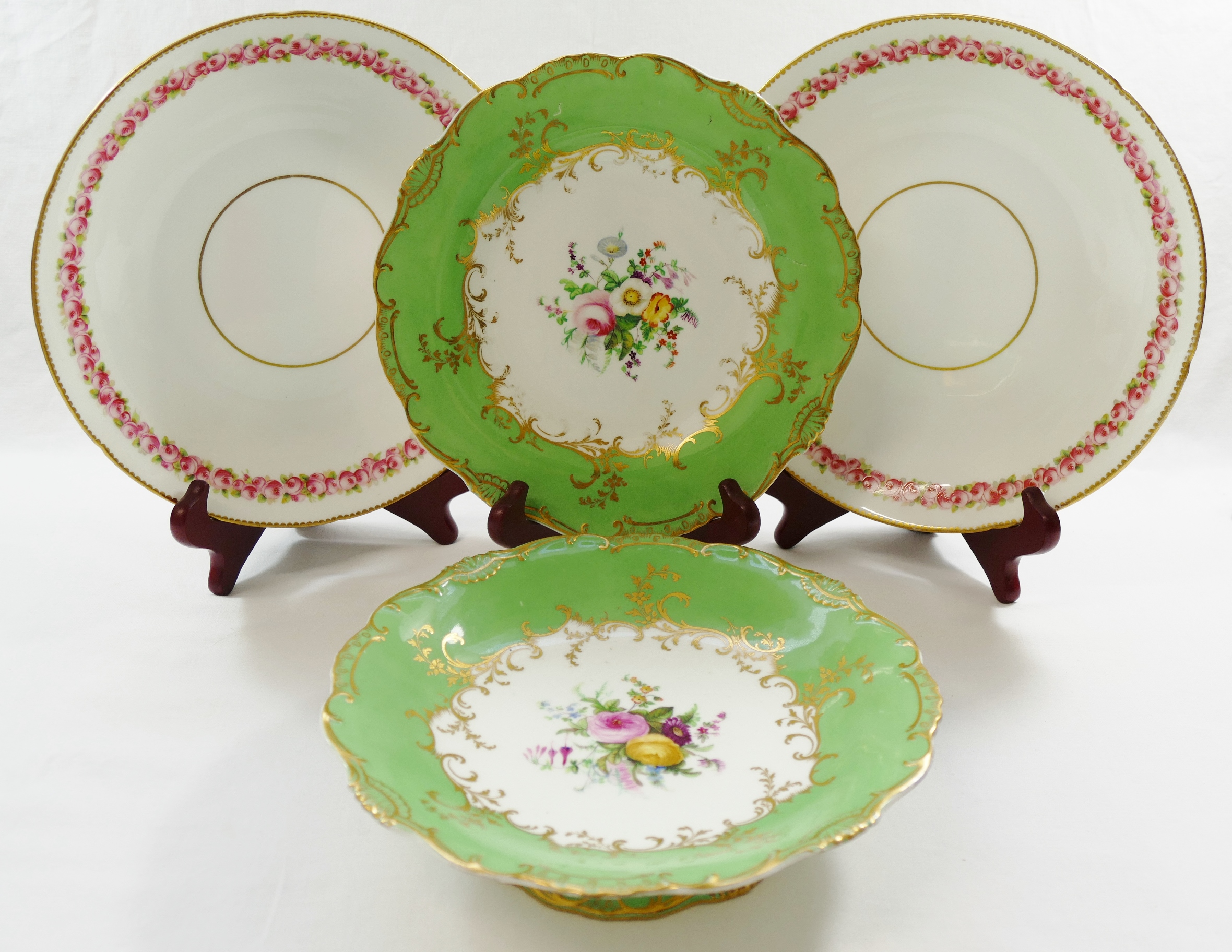 A Minton porcelain plate and tazza, with apple green border,