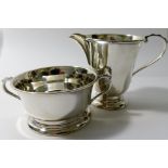 A silver cream jug and sugar bowl, Birmingham 1972, the jug 7.7cm high, combined weight 4.