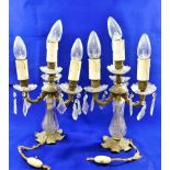 A pair of lustre hung four-light candelabra, converted to electricity,