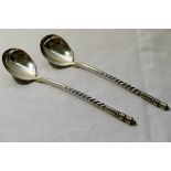 A pair of Russian silver serving spoons with formal niello decoration to the bowls,