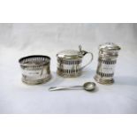 A three piece silver cruet, comprised of a salt (liner lacking), pepperette,