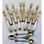 A set of 12 silver coloured metal fruit forks, stamped '950 Sterling',