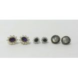 A pair of 18ct green sapphire and diamond cluster earrings and a pair of moonstone earrings (three
