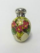 A Victorian white china scent bottle of egg shape, finely painted with flowers with gilt outlines