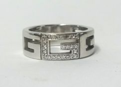 An 18ct Gucci designer ring set with diamonds with box and outer box, approx 9.20gms, finger size