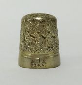 A silver thimble in original fitted case.
