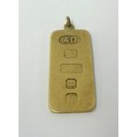 A 9ct gold pendant with oversized hallmarks, approx 9.10gms.