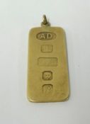 A 9ct gold pendant with oversized hallmarks, approx 9.10gms.