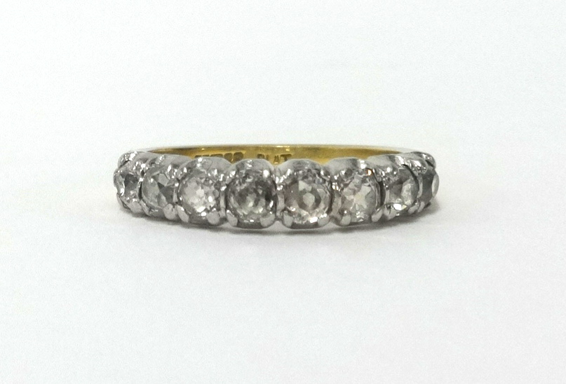 An 18ct five stone diamond ring, finger size R.