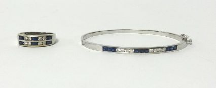 A 14k white gold sapphire and diamond ring and bangle, finger size S.