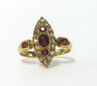 An 18ct antique ruby and diamond marquise set ring, finger size L.