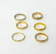 Six band rings comprising four 9ct gold rings, approx 10.70gms, one 22ct gold ring, approx 3.90gms