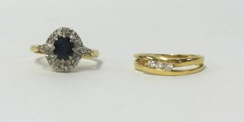 An 18ct diamond set ring and an 18ct sapphire and diamond ring (2), finger size K.