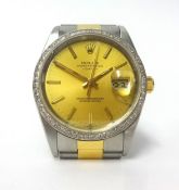 Rolex, a gents stainless steel and gold calendar wristwatch, with diamond bezel, Oyster Perpetual