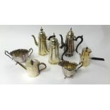 A quantity of assorted silver plated wares including coffee pots, chocolate pots, tea set etc.