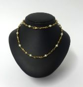 A 9ct gold and pearl necklace, approx 27gms.