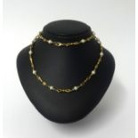 A 9ct gold and pearl necklace, approx 27gms.