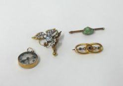 An antique sapphire and pearl five stone brooch in yellow metal, a moonstone and filigree