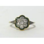 An Edwardian 18ct emerald and diamond cluster ring, finger size L.