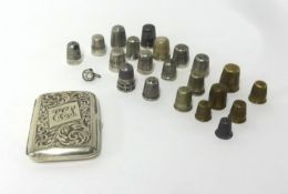 A silver cigarette case and a mixed collection of thimbles.
