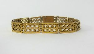 A pre-war 1932 15ct gold pierced link bracelet, approx 17.2gms.