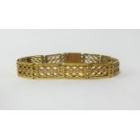 A pre-war 1932 15ct gold pierced link bracelet, approx 17.2gms.