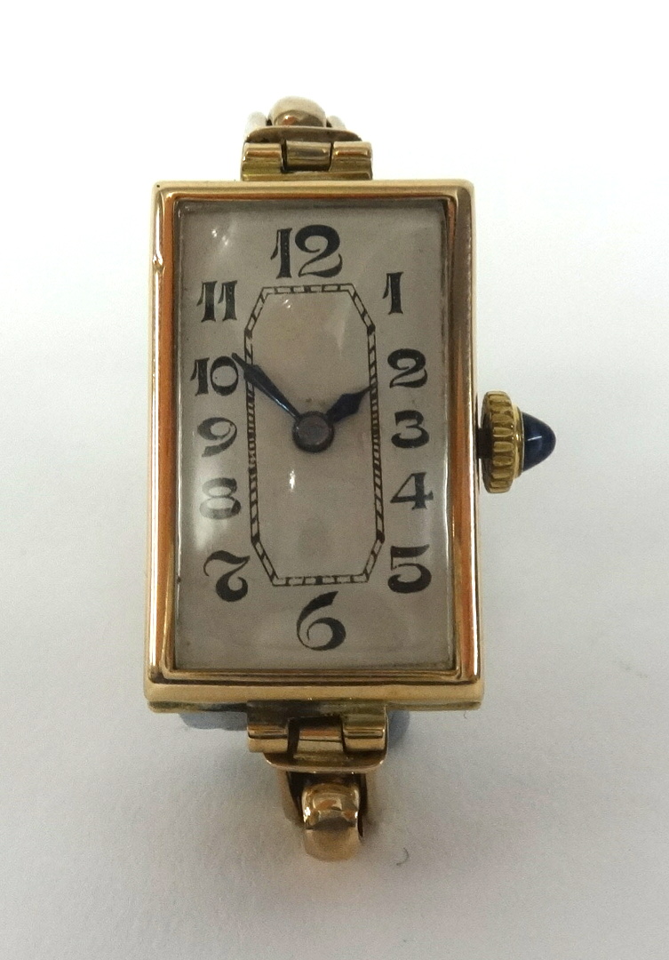 A vintage ladies 9ct gold rectangular wristwatch with jewelled crown, the back plate stamped '