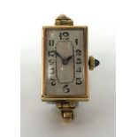 A vintage ladies 9ct gold rectangular wristwatch with jewelled crown, the back plate stamped '