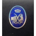 A 18ct oval enamel brooch, maker stamp 'L.E.B & S', 39mm x 30mm, approx 19gms.