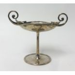 George Connell, an Edwardian Arts and Crafts silver stem dish with scroll handle decoration and