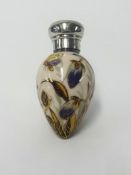 A Victorian silver and porcelain scent bottle of egg shape decorated with flowers and a butterfly in