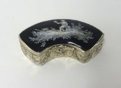 A continental silver and enamel curb shaped box, the black and white scene depicting a cherub