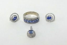 A tanzanite and diamond ring, together with a similar pair of earrings and pendant.
