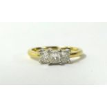 An 18ct diamond three stone ring set with three princess cut diamonds, finger size T.