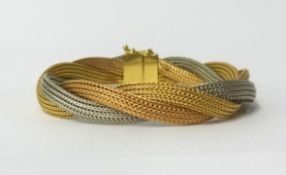 An 18ct tri colour gold twisted bracelet, approx 25gms.