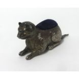 An Egyptian silver cat pin cushion, length approx 8.50cm, makers mark 'A & L Ltd, (Adie &