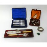 Four cased sets including a fitted nail set, fish set and cake knives together with a silver