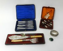 Four cased sets including a fitted nail set, fish set and cake knives together with a silver