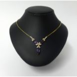 An 18ct amethyst and diamond drop pendant necklace, approx 18.6gms.
