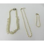 A pearl necklace and matching bracelet with a 9ct gold clasp and another (3).