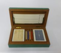 A boxed card game with shagreen effect box.