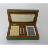 A boxed card game with shagreen effect box.