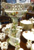 A large 20th century German porcelain centre piece, encrusted with flowers, with gilt decoration and