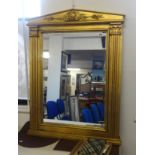 A reproduction of a Georgian gilt framed and architectural mirror,